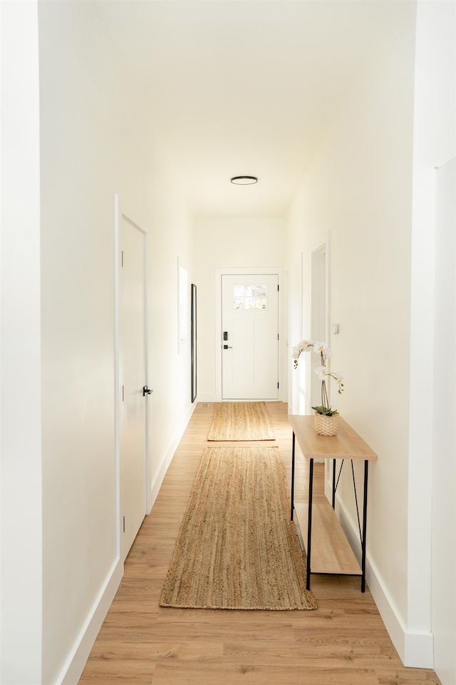 corridor featuring light hardwood / wood-style floors