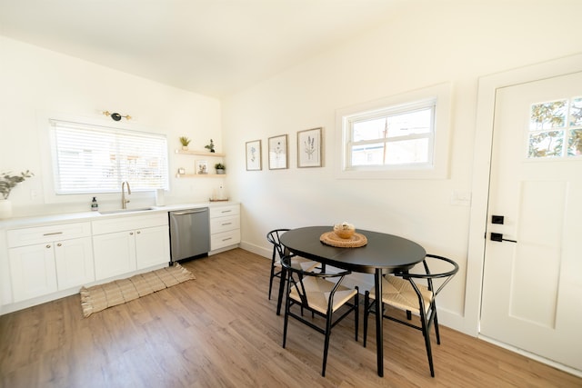 dining area featuring light hardwood / wood-style flooring and a healthy amount of sunlight