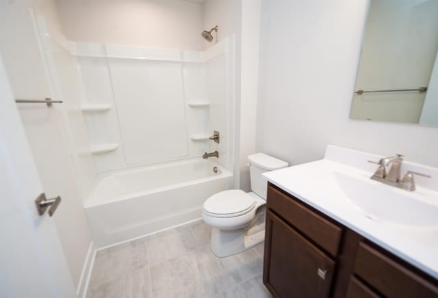 full bathroom with washtub / shower combination, toilet, and vanity