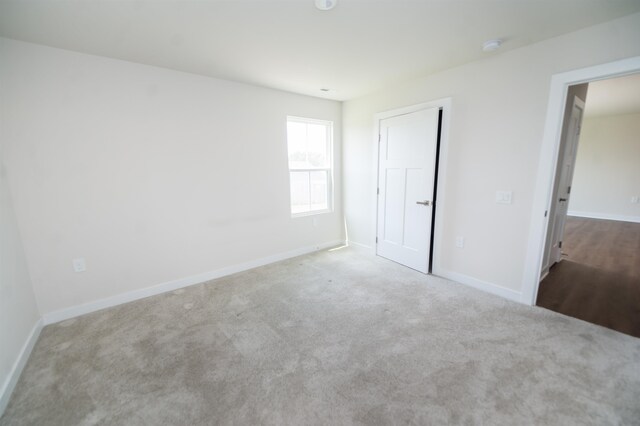 unfurnished bedroom with carpet flooring