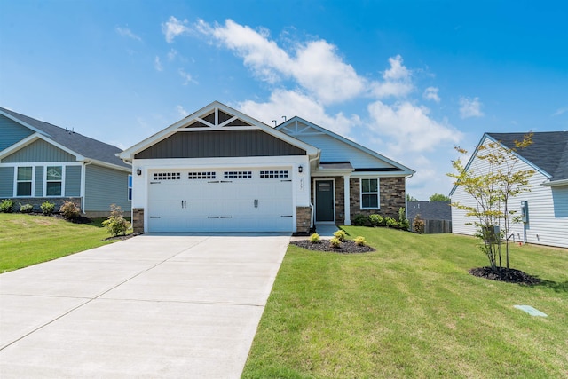 craftsman house with a garage and a front lawn