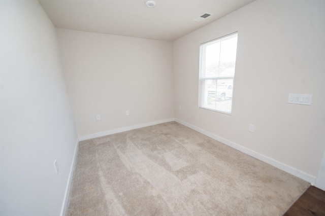 empty room with light colored carpet