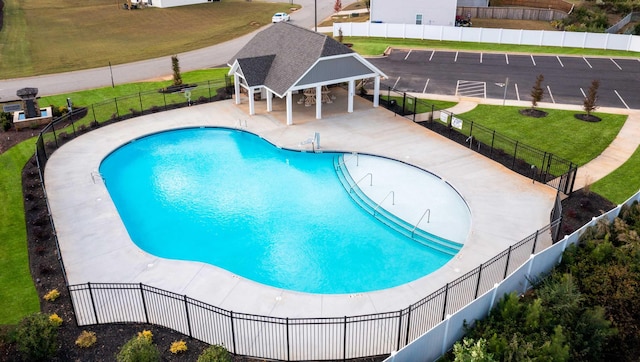 view of pool featuring a yard and a gazebo