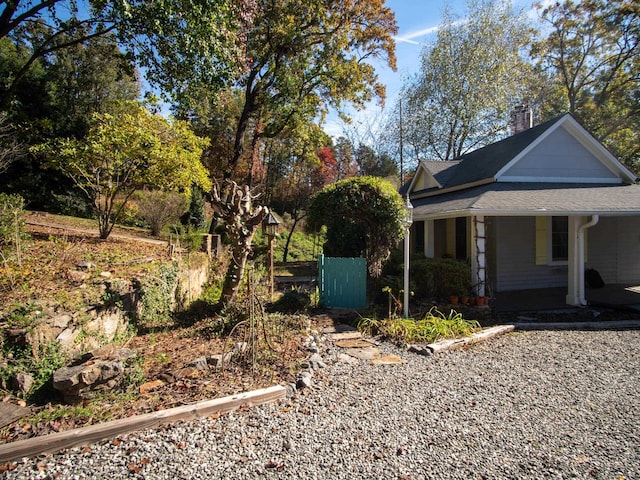 view of side of home with a porch