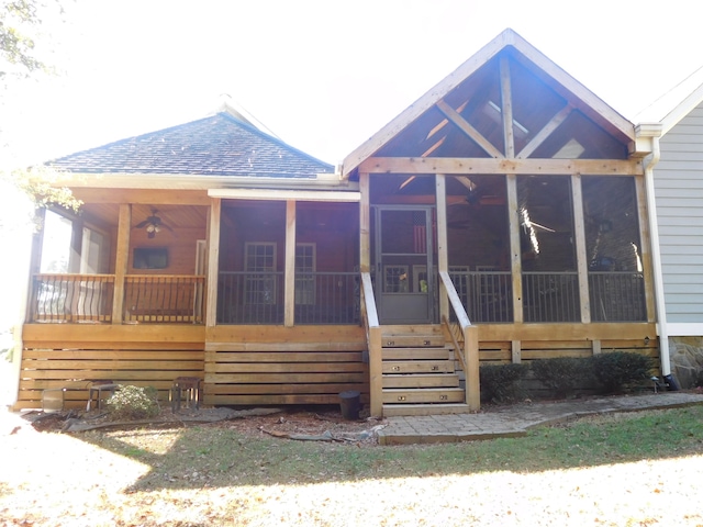 rear view of house with a sunroom