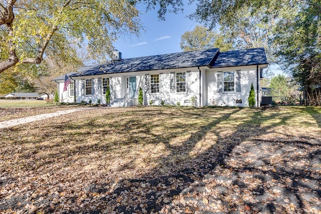 ranch-style home with a front yard