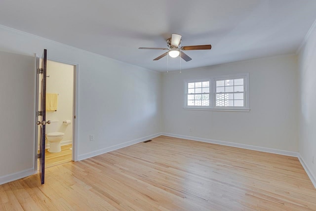 empty room featuring ceiling fan, ornamental molding, and light hardwood / wood-style flooring