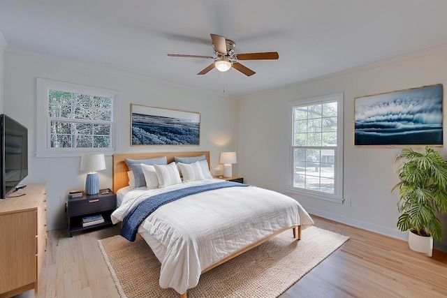 bedroom with ceiling fan, ornamental molding, and light wood-type flooring