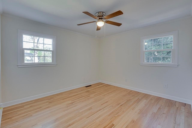 unfurnished room with ceiling fan, light hardwood / wood-style floors, and ornamental molding