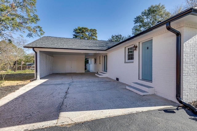 view of side of home with a carport