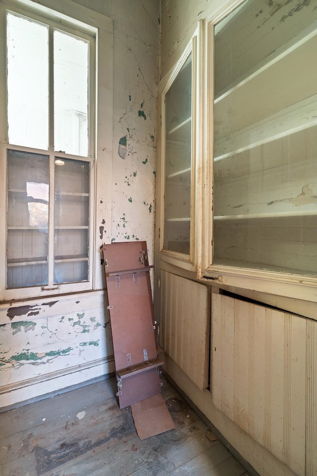 empty room with hardwood / wood-style floors