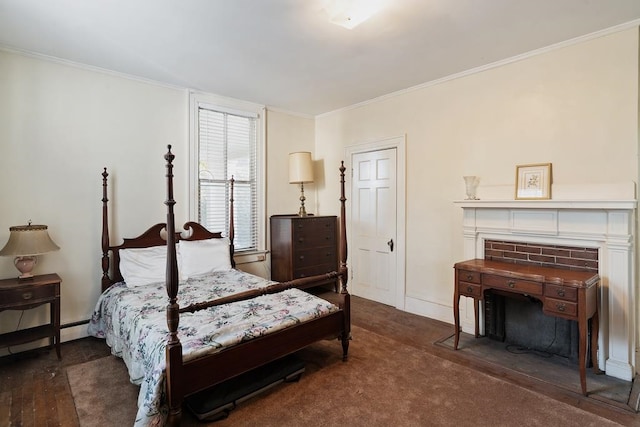 bedroom with dark hardwood / wood-style flooring, baseboard heating, crown molding, and a brick fireplace