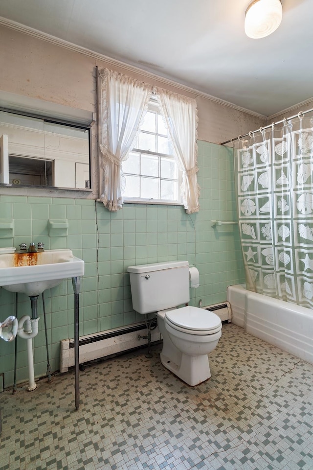 bathroom with toilet, shower / bath combination with curtain, tile walls, and a baseboard heating unit