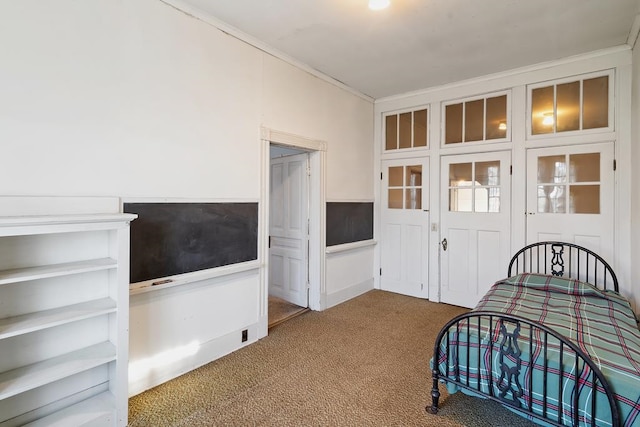 bedroom featuring carpet and crown molding