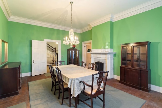 dining space with ornamental molding and a notable chandelier