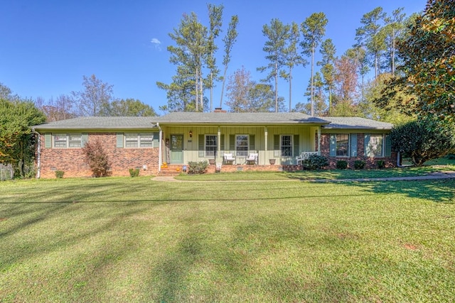 single story home with a porch, a front lawn, and brick siding