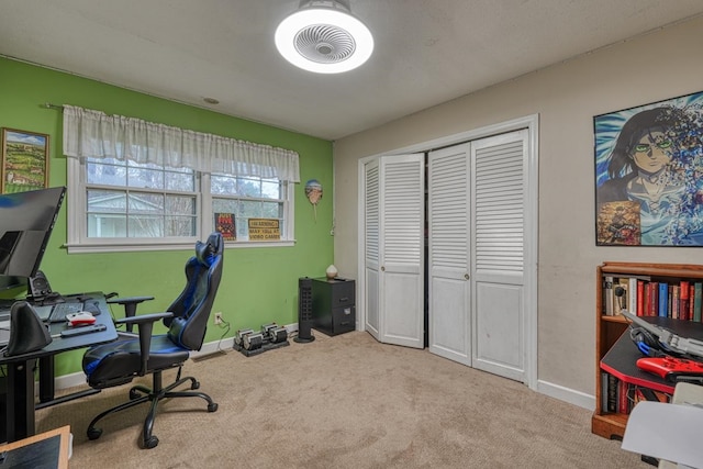 carpeted office with baseboards