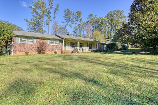 ranch-style home with a porch, crawl space, brick siding, and a front lawn