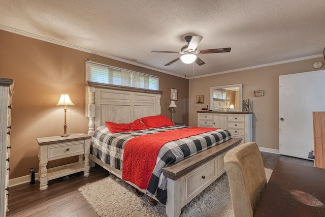 bedroom with a textured ceiling, ornamental molding, wood finished floors, and baseboards