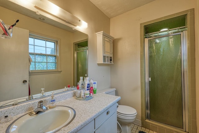 full bath featuring toilet, a stall shower, and vanity