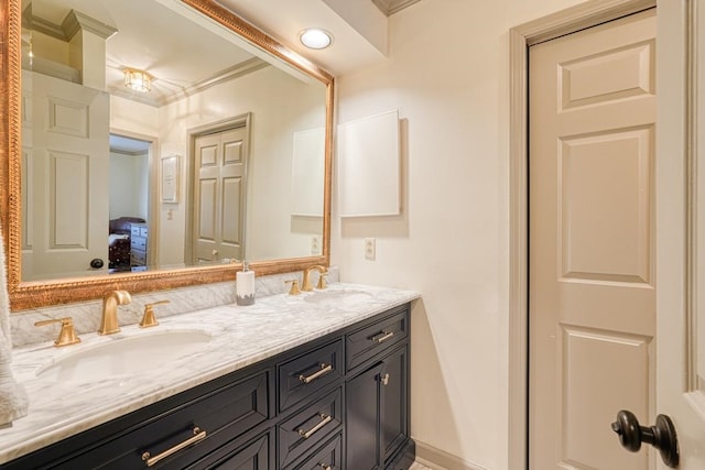 bathroom with vanity and crown molding