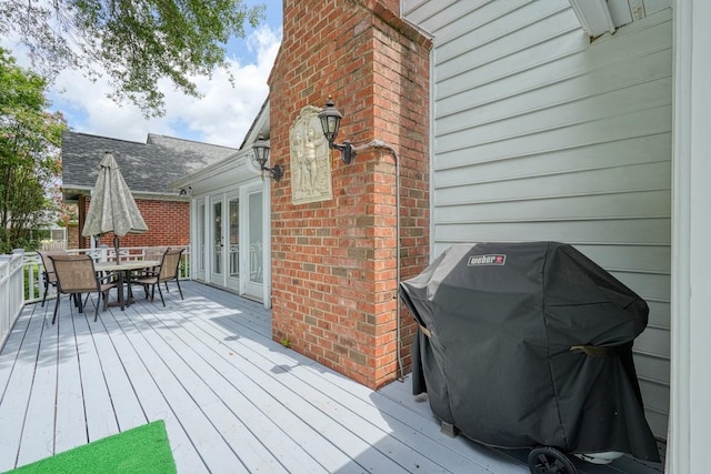 deck with area for grilling and french doors