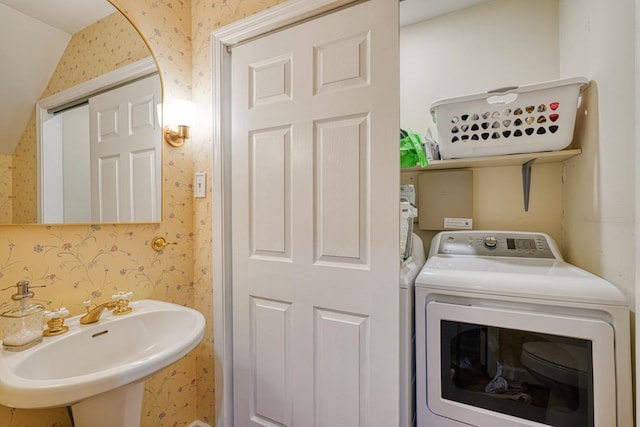 laundry area with washer / dryer and sink