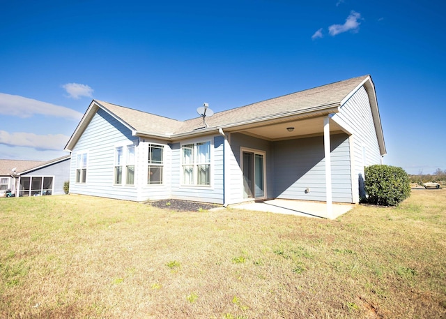 back of house featuring a yard and a patio