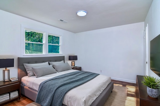 bedroom featuring hardwood / wood-style floors