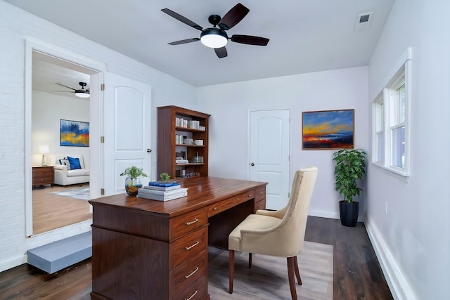 home office featuring ceiling fan and dark hardwood / wood-style flooring