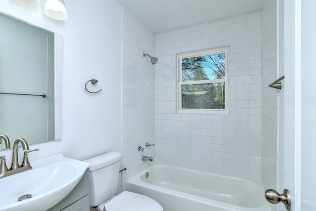 full bathroom with vanity, toilet, and tiled shower / bath combo