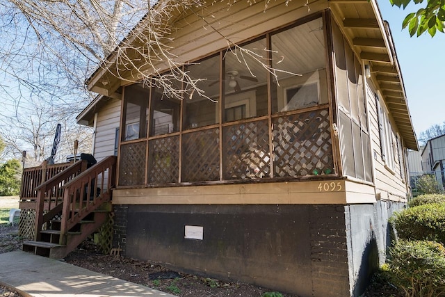 view of home's exterior featuring a sunroom