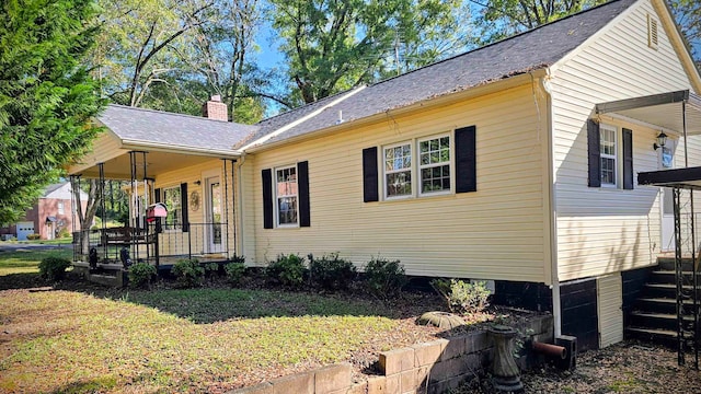 view of property exterior with a porch