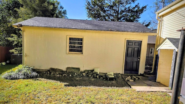 view of outdoor structure with a lawn