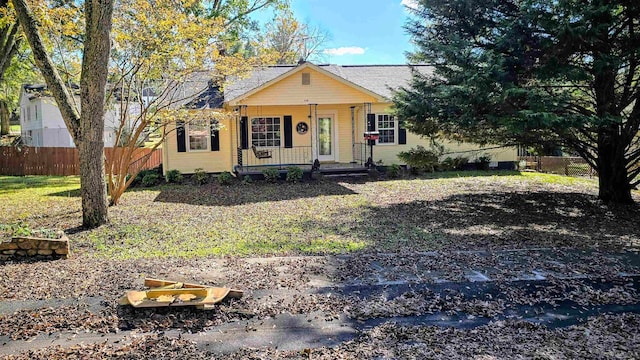 ranch-style house with covered porch