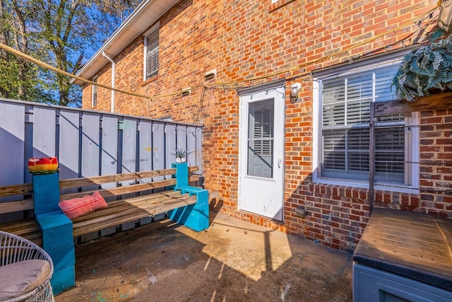 property entrance featuring a wooden deck