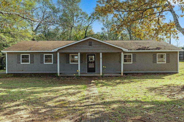 ranch-style house with a front yard and a porch