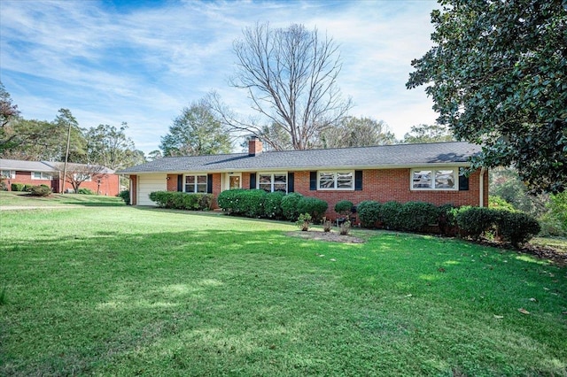 ranch-style home with a garage and a front lawn