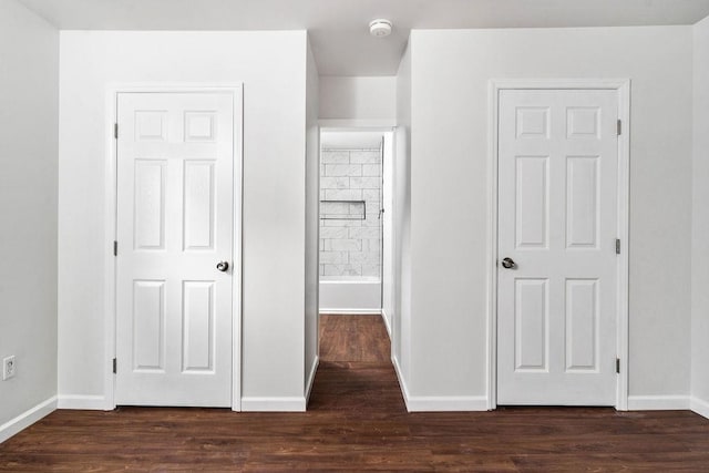 unfurnished bedroom featuring dark wood-type flooring