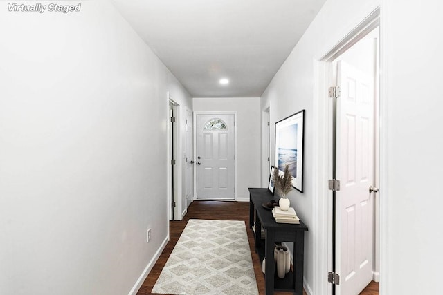 hall with dark hardwood / wood-style flooring