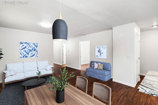 living room with dark hardwood / wood-style floors