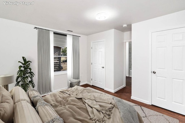 bedroom featuring dark wood-type flooring