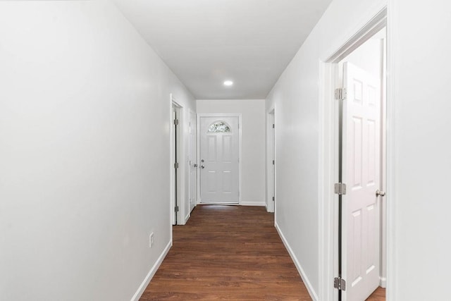 corridor featuring dark hardwood / wood-style floors