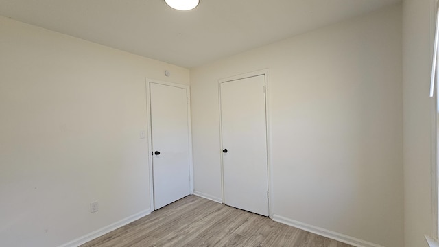 unfurnished bedroom with light hardwood / wood-style flooring