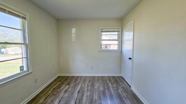 spare room featuring dark hardwood / wood-style floors