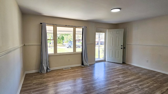 empty room with hardwood / wood-style floors