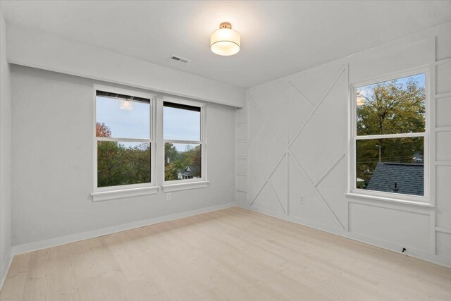 empty room with light wood-type flooring