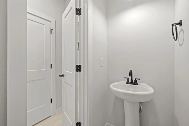 bathroom featuring sink and hardwood / wood-style flooring