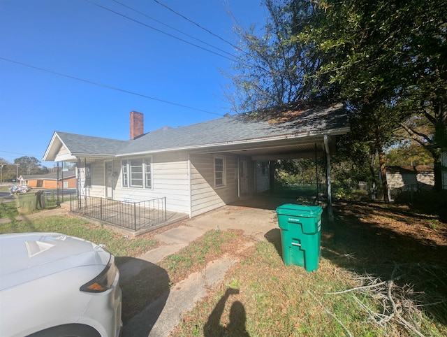 view of home's exterior with a carport