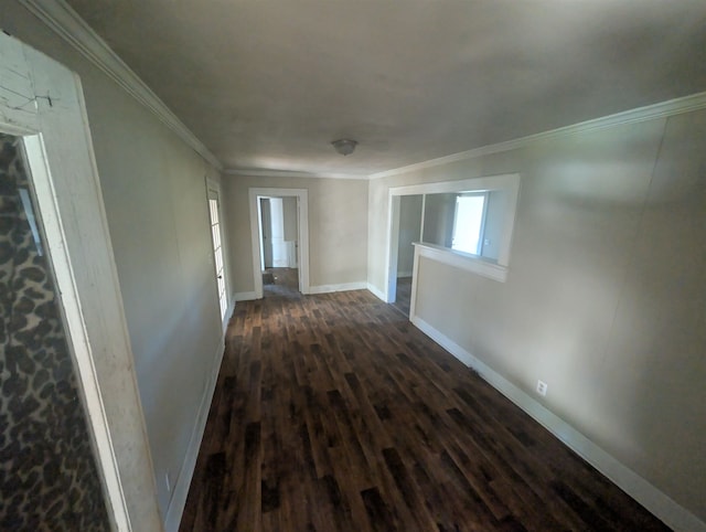 corridor with dark hardwood / wood-style floors and crown molding